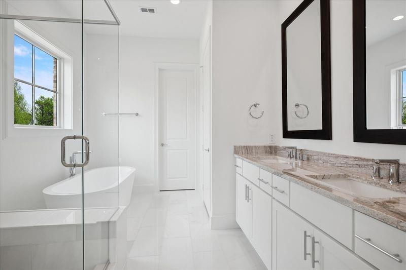 1362 East Crosby Road Carrollton, TX 75006 - Photo 19 of 26 a bathroom with a double vanity sink and mirror
