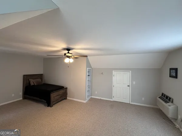 a large spacious bathroom with a large tub and sink