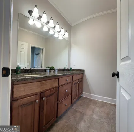 a bedroom with furniture and a tv