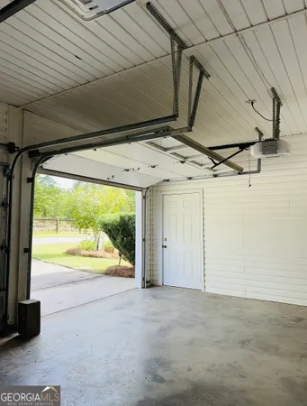 a room with lots of books and a large window