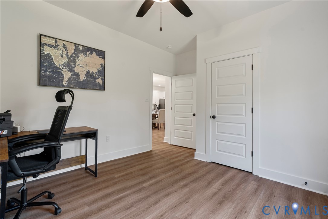 4316 Mt Airy Road Louisa, VA 23093 - Photo 20 of 45 a view of a workspace with furniture and wooden floor