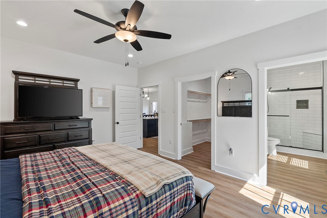 4316 Mt Airy Road Louisa, VA 23093 - Photo 25 of 45 a bedroom with a bed and a flat screen tv