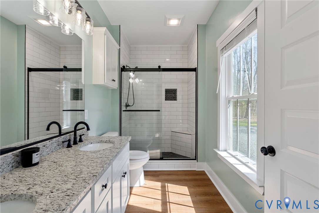 4316 Mt Airy Road Louisa, VA 23093 - Photo 28 of 45 a bathroom with a granite countertop sink mirror and double