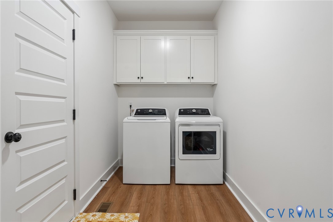 4316 Mt Airy Road Louisa, VA 23093 - Photo 30 of 45 a utility room with wooden floor washer and dryer