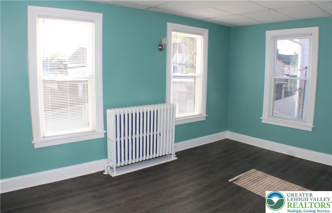 115 Howertown Road Catasauqua, PA 18032 - Photo 16 of 33 Front bedroom has tons of light and engineered hardwood