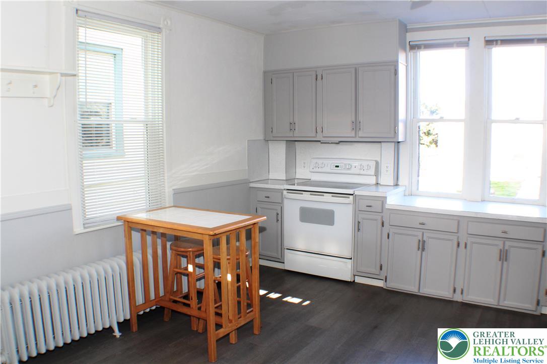 115 Howertown Road Catasauqua, PA 18032 - Photo 10 of 33 Kitchen, Eat=in capable, and mega windows. Electric flat top stove