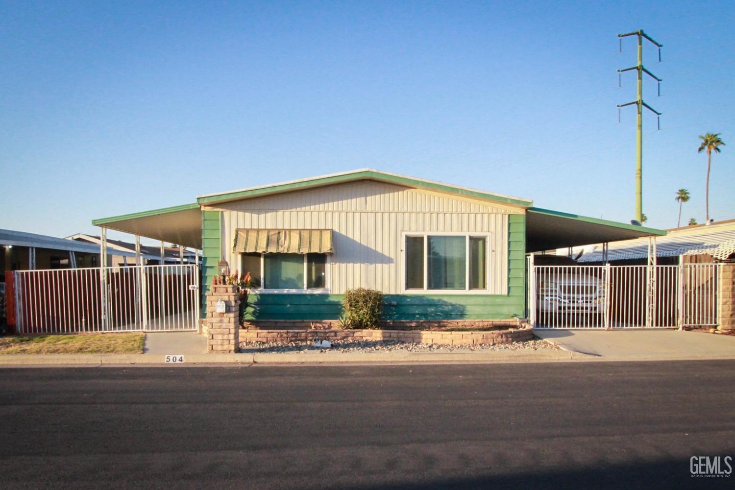 a front view of a house with a street