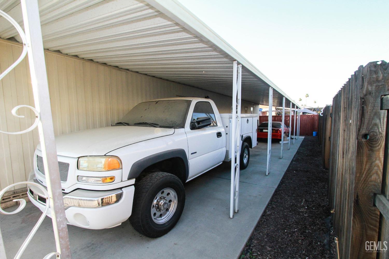 Undisclosed Address Bakersfield, CA 93301 - Photo 23 of 27 a view of car parked in garage