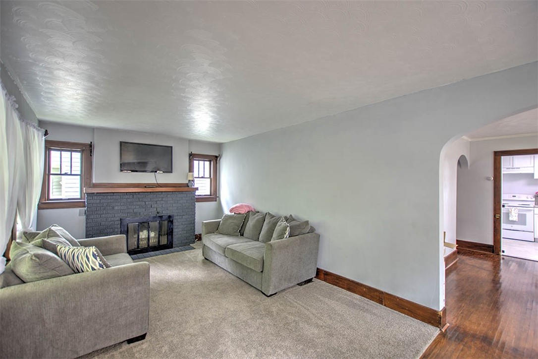 1344 West Sunset Avenue Decatur, IL 62522 - Photo 4 of 17 a living room with furniture and a fireplace