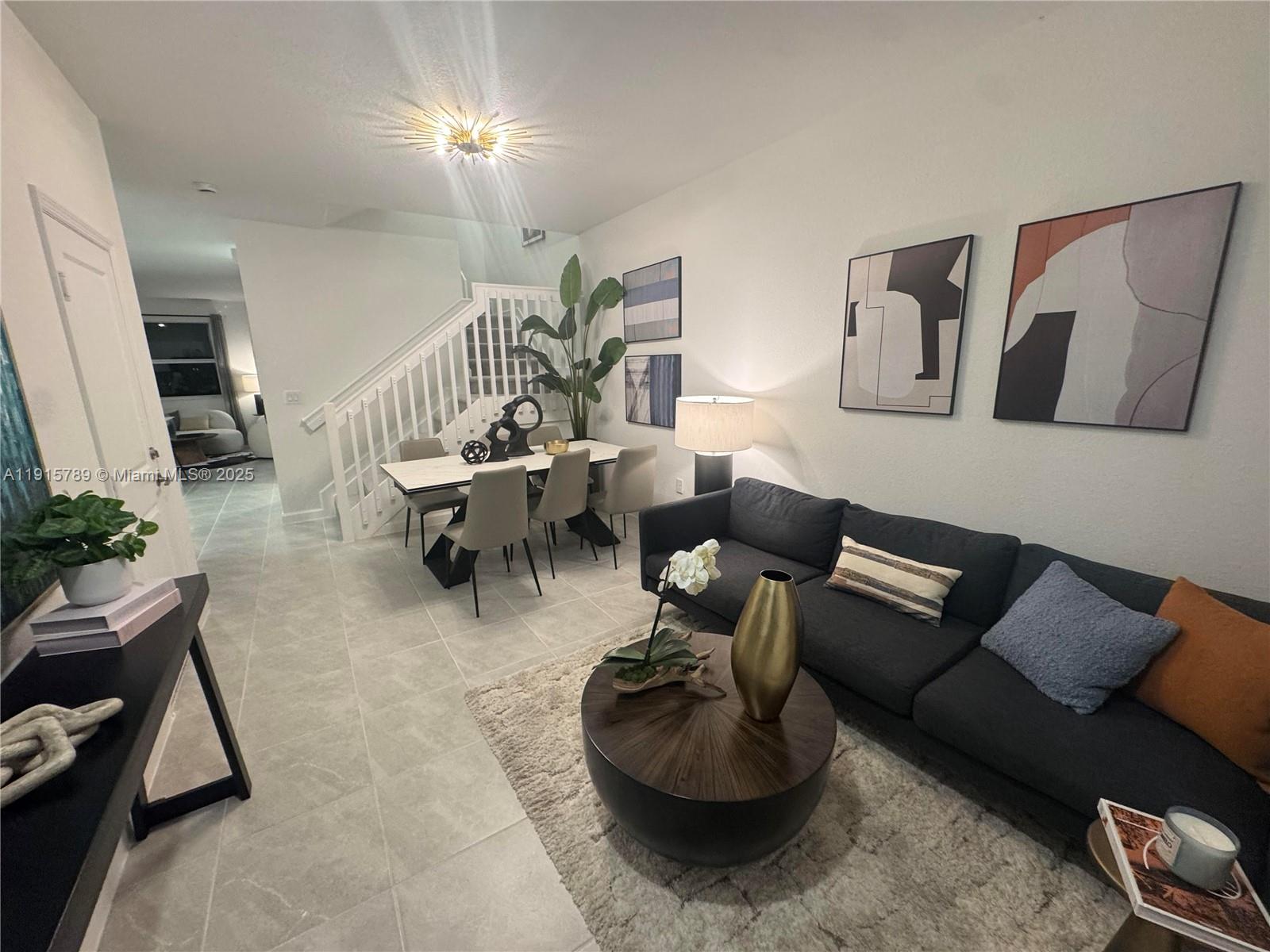 a living room with furniture and a rug