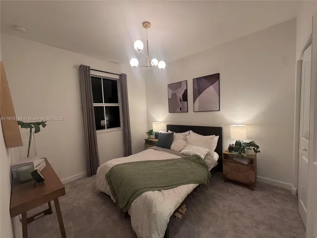 a bedroom with a bed and a chair