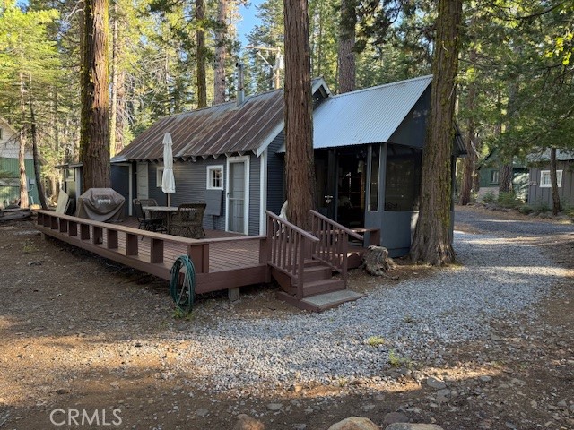 9002 Humboldt Road Forest Ranch, CA 95942 - Photo 1 of 11 a view of a house with a yard and sitting area