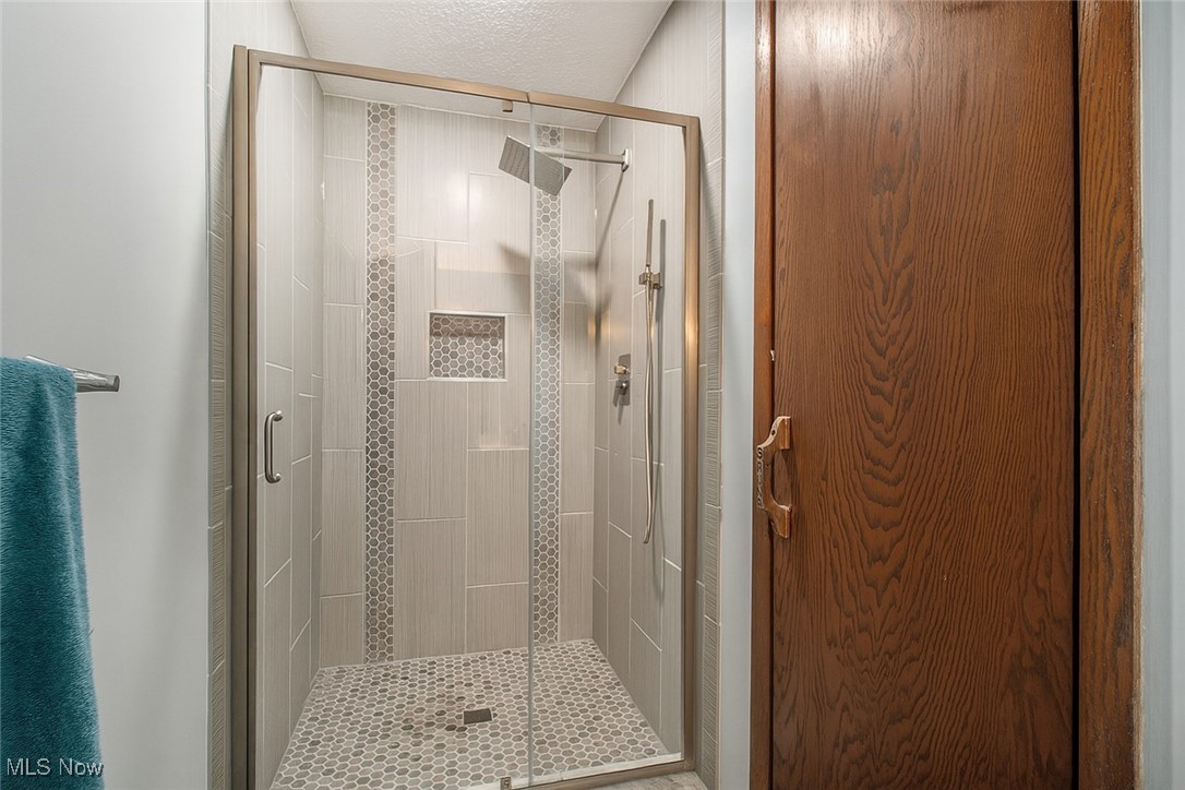 3085 Hamlin Road Medina, OH 44256 - Photo 29 of 50 Stellar walk in shower with a Rainforest shower head & a cubby for shampoo