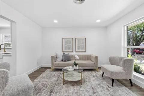 a living room with furniture and a table