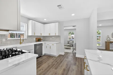 a kitchen with a stove and a sink