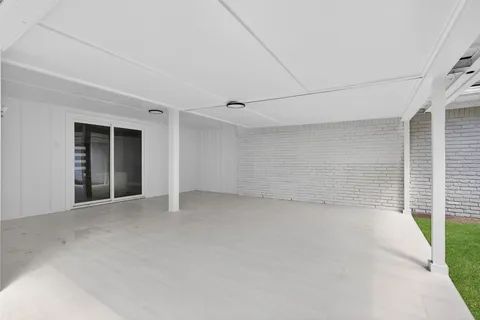 a front view of a house with a garden and yard