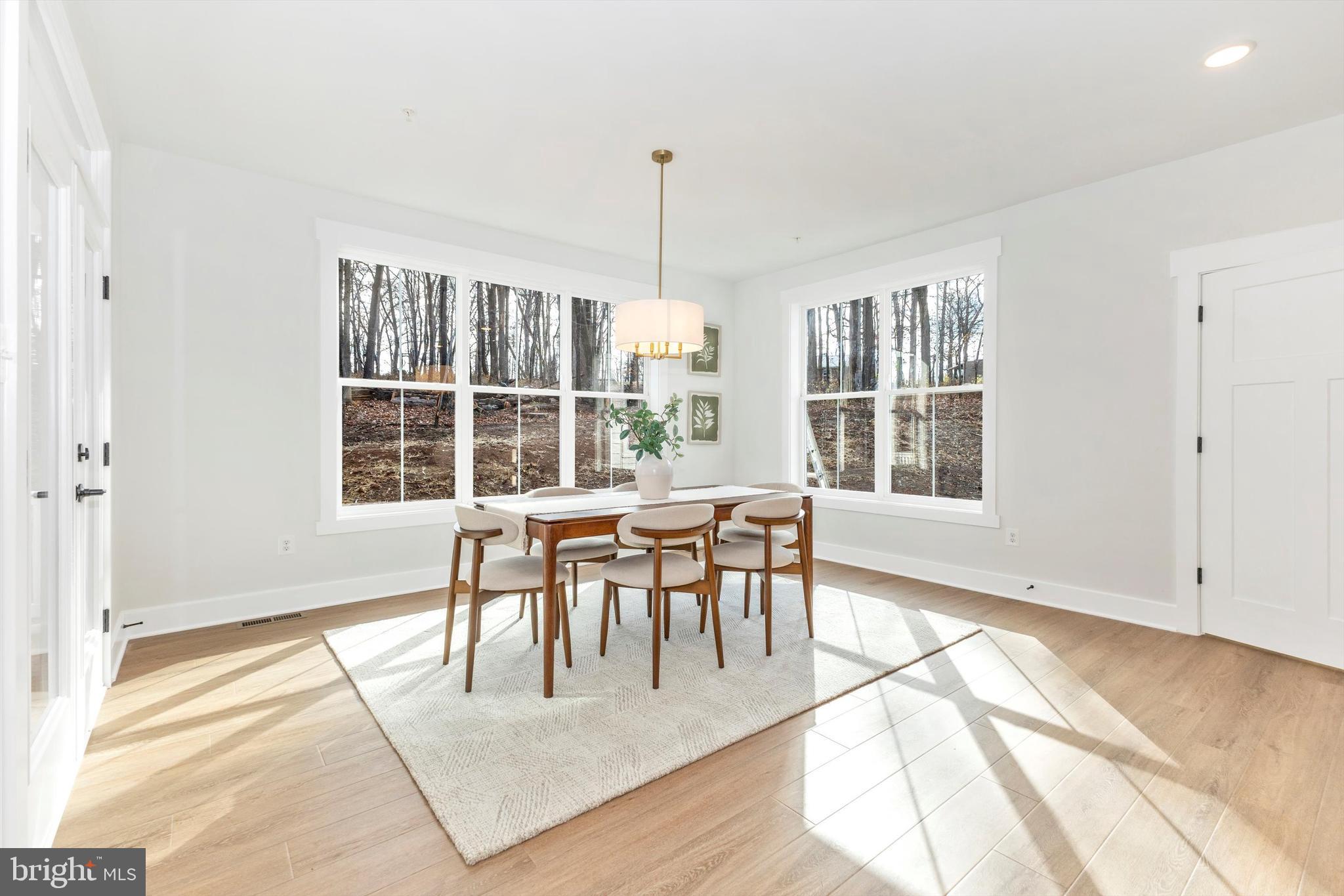 1199 Hoods Mill Road Cooksville, MD 21723 - Photo 16 of 86 a view of a dining room with furniture and windows