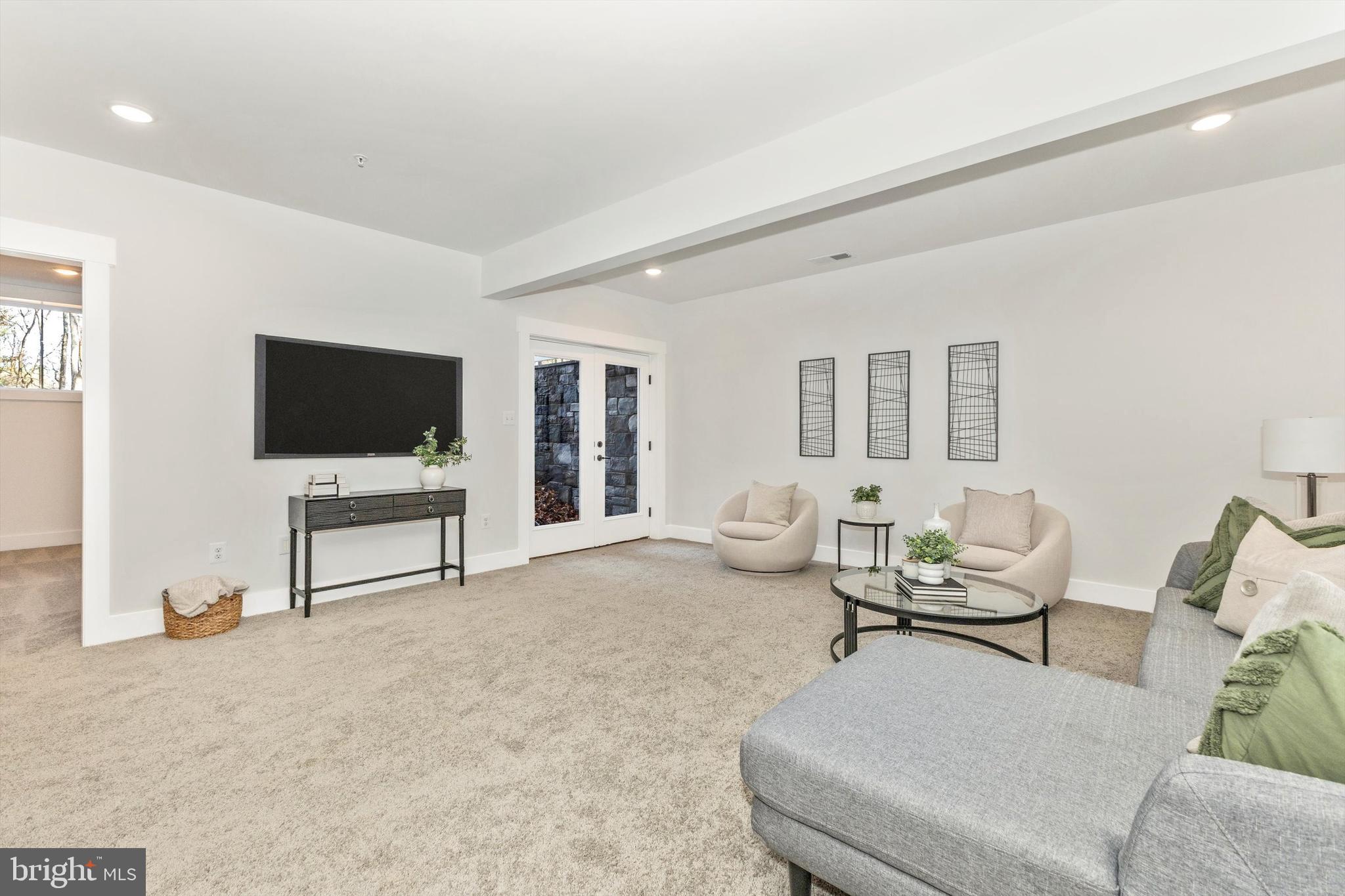 1199 Hoods Mill Road Cooksville, MD 21723 - Photo 49 of 86 a living room with furniture and a flat screen tv