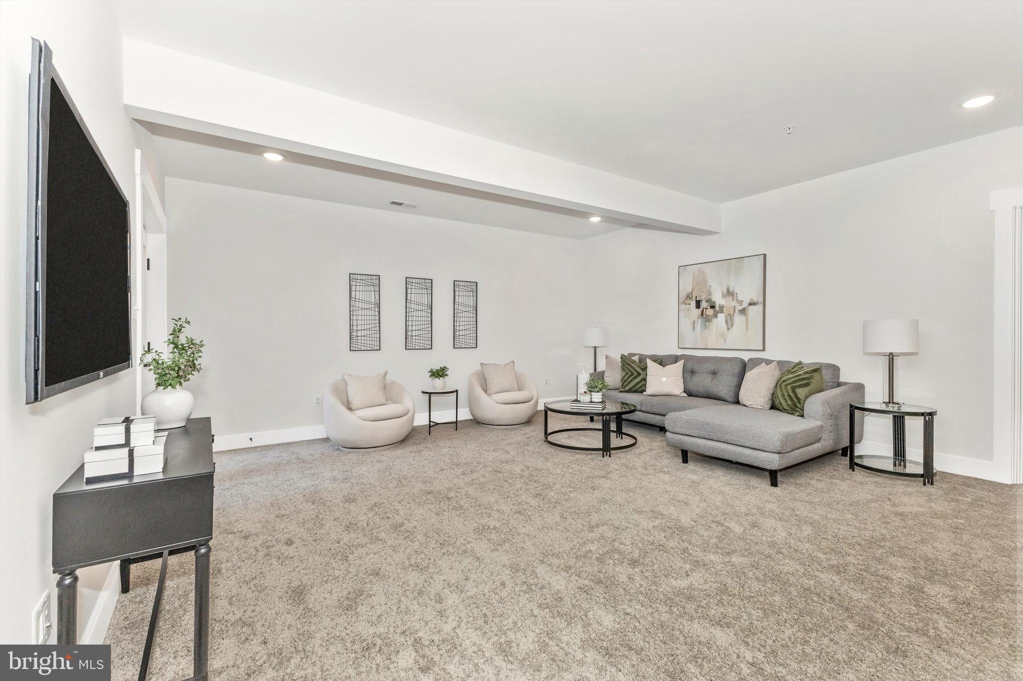 1199 Hoods Mill Road Cooksville, MD 21723 - Photo 50 of 86 a living room with furniture and a flat screen tv