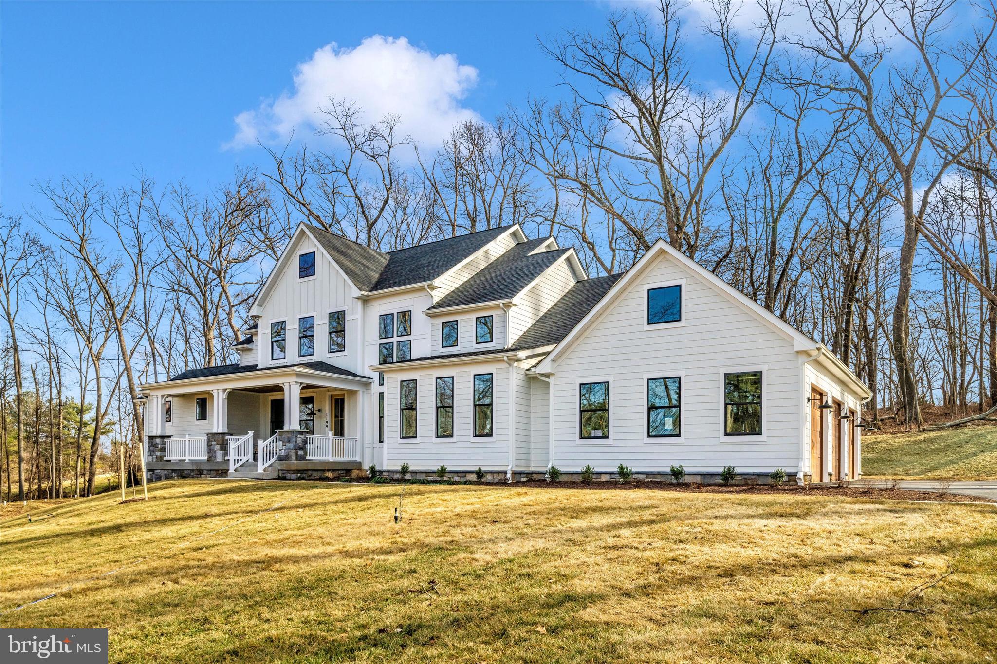 1199 Hoods Mill Road Cooksville, MD 21723 - Photo 55 of 86 a front view of a house with a garden