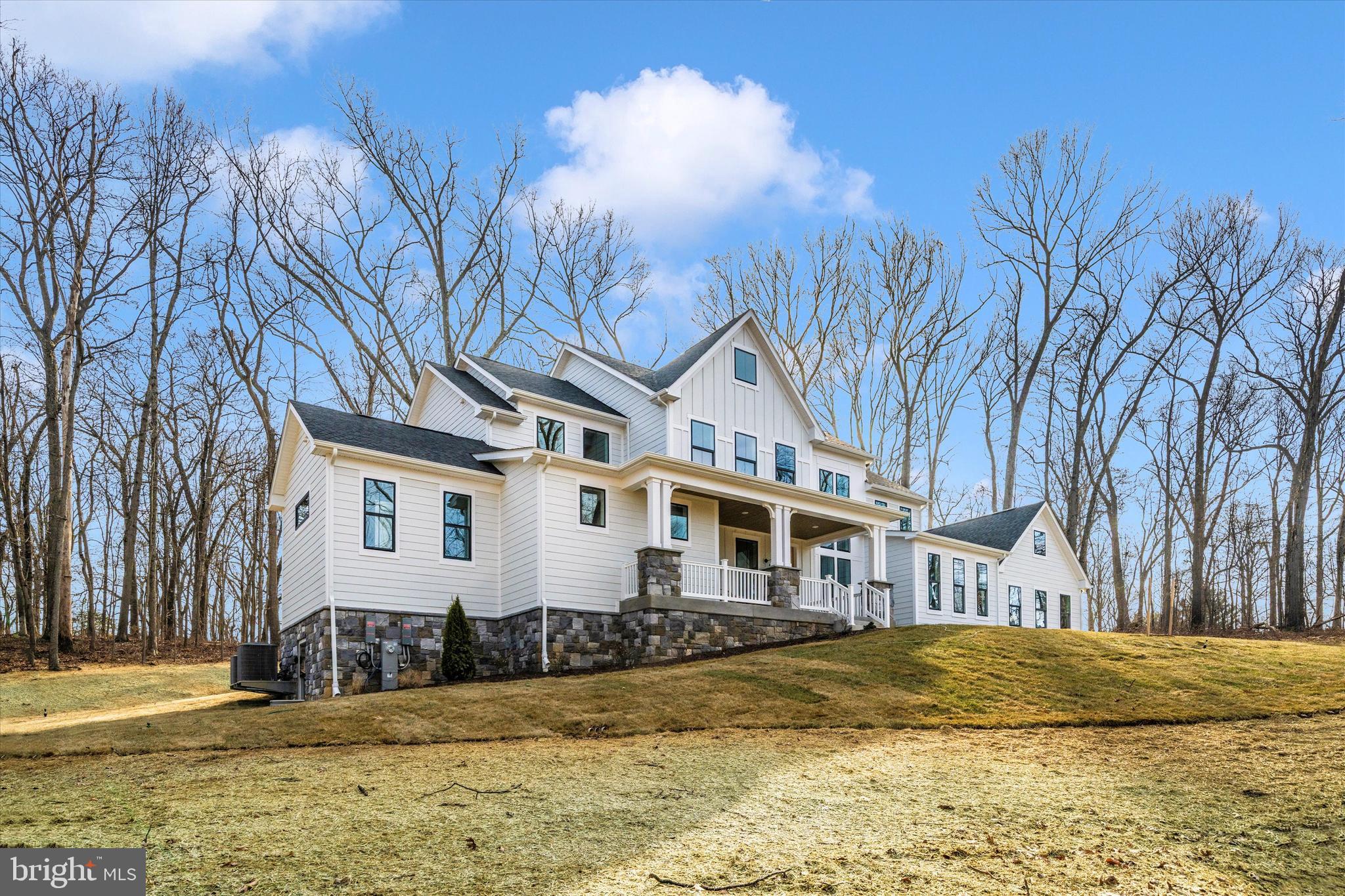 1199 Hoods Mill Road Cooksville, MD 21723 - Photo 56 of 86 a front view of a house with a yard