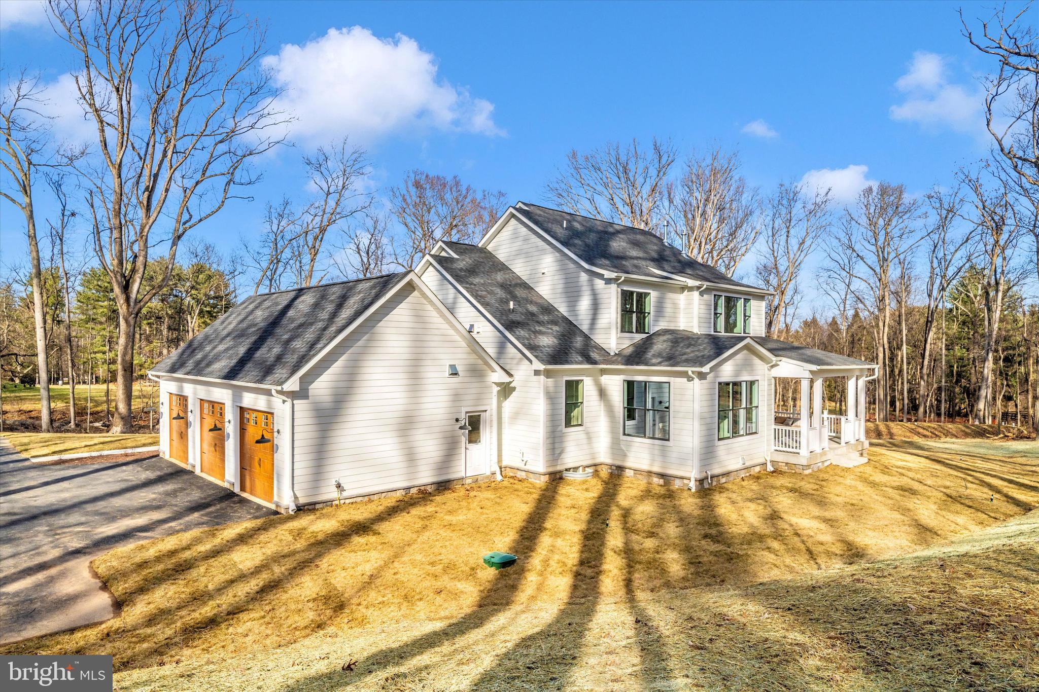 1199 Hoods Mill Road Cooksville, MD 21723 - Photo 63 of 86 a view of a white house with a large trees