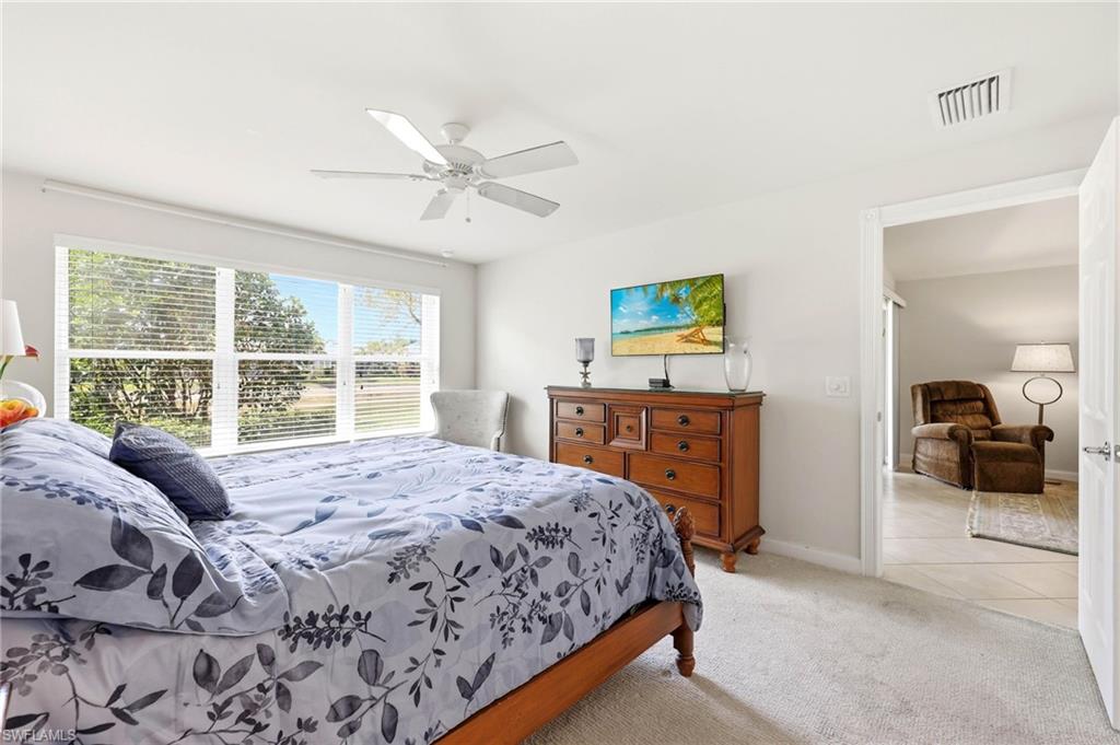 8664 Genova Court Naples, FL 34114 - Photo 13 of 46 a bedroom with a bed and a large window