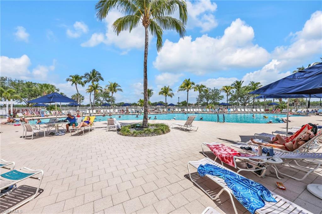8664 Genova Court Naples, FL 34114 - Photo 31 of 46 a view of a patio with swimming pool