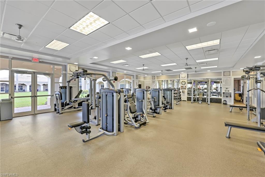 8664 Genova Court Naples, FL 34114 - Photo 35 of 46 a view of a room with gym equipment