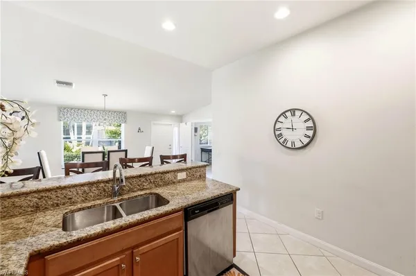a view of a kitchen with a sink and cabinets