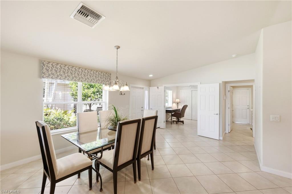 8664 Genova Court Naples, FL 34114 - Photo 7 of 46 a dining room with furniture and window