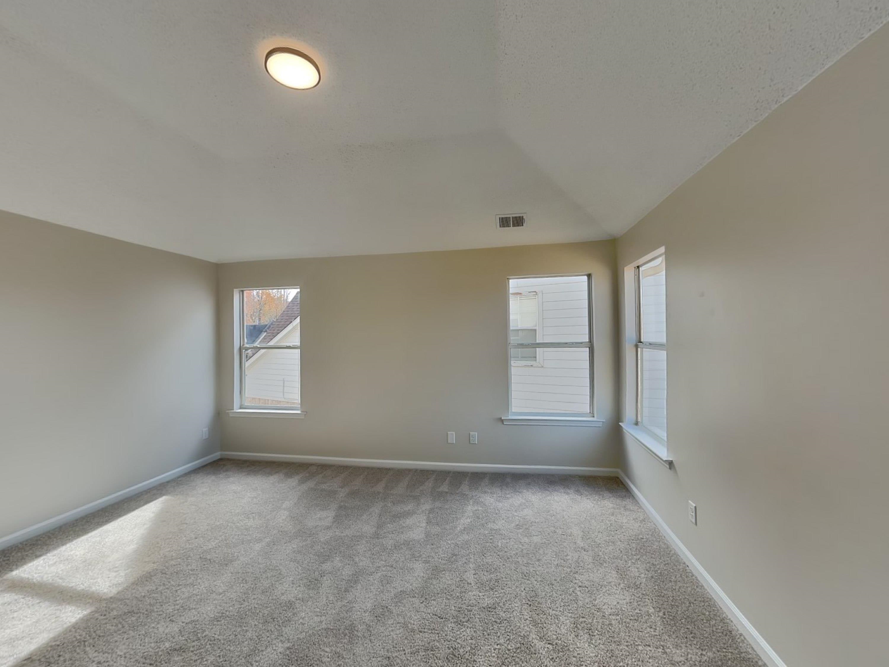 7902 Pinefrost Lane Memphis, TN 38125 - Photo 8 of 18 an empty room with windows