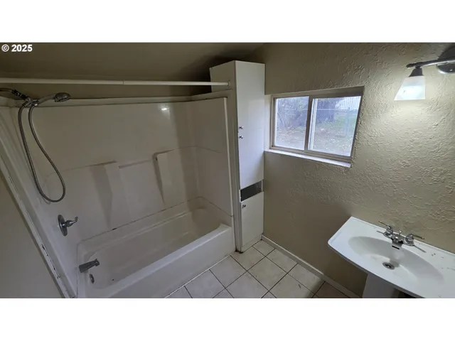 a open area with furniture and hardwood floor