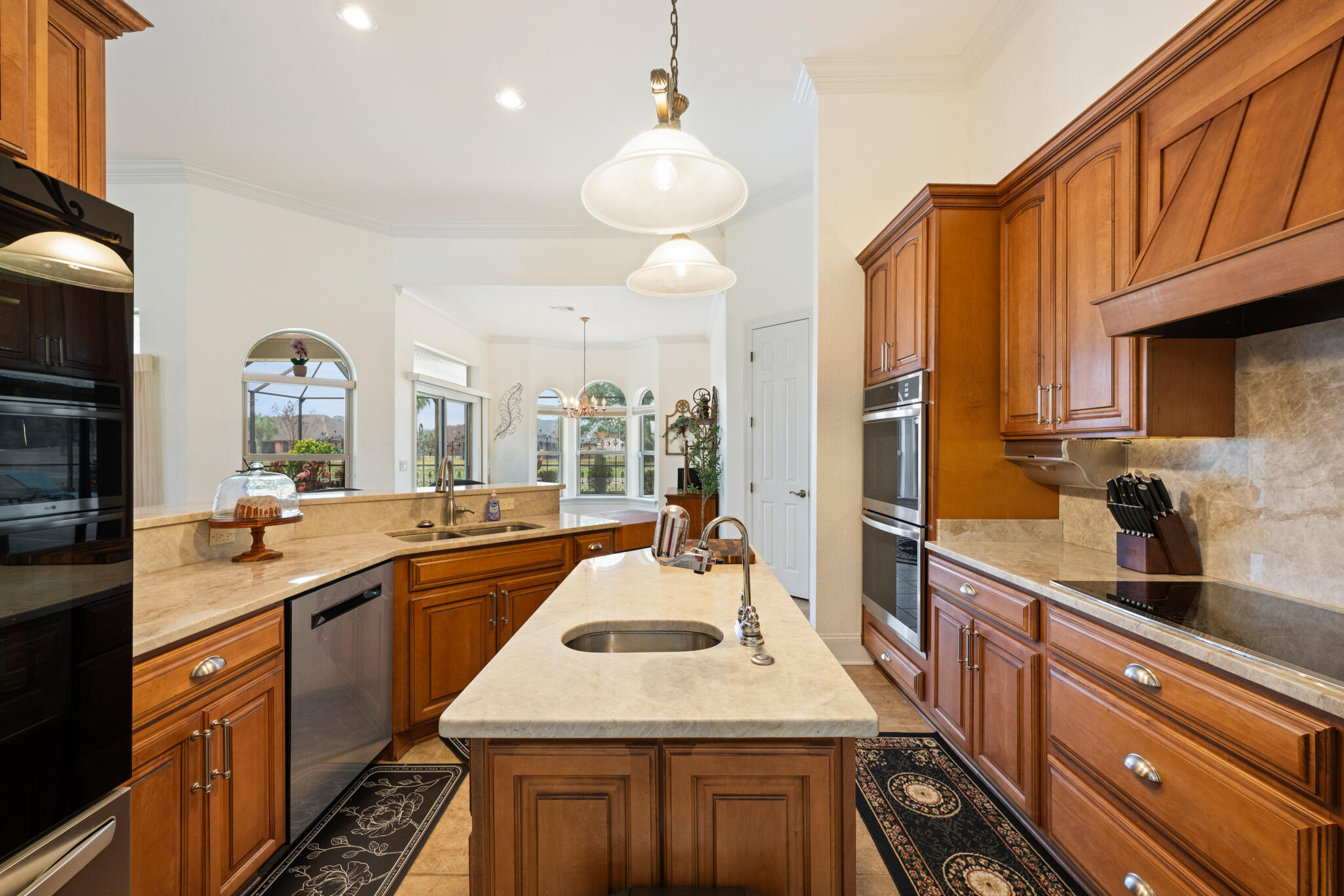 2615 Masters Boulevard Navarre, FL 32566 - Photo 11 of 51 a kitchen with a sink stove and cabinets