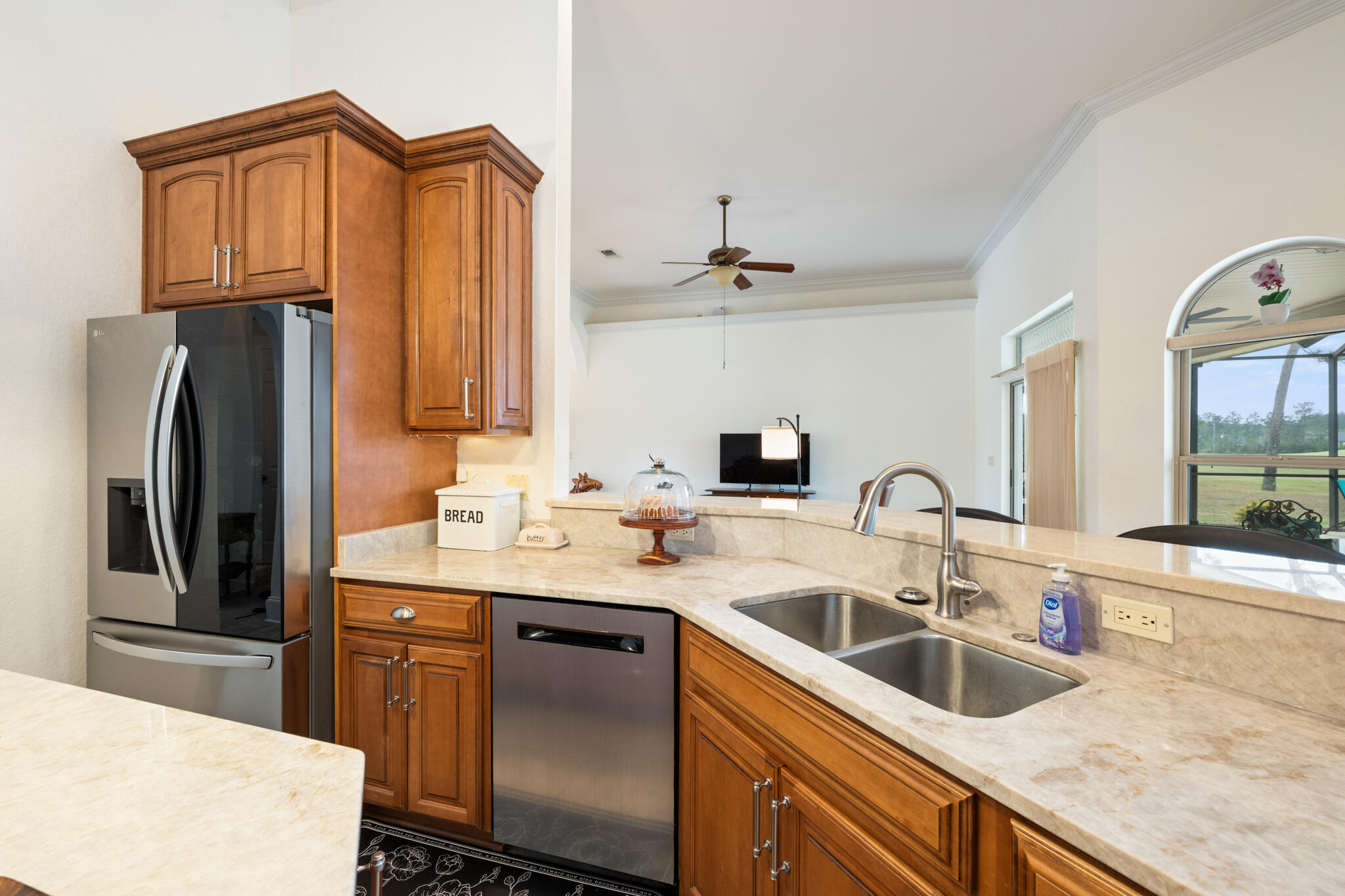 2615 Masters Boulevard Navarre, FL 32566 - Photo 12 of 51 a kitchen with stainless steel appliances a sink and a refrigerator
