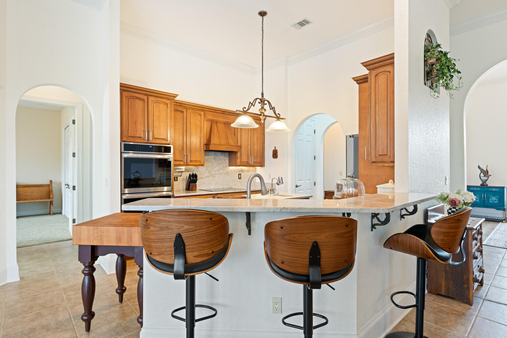 2615 Masters Boulevard Navarre, FL 32566 - Photo 13 of 51 a view of kitchen island dining table and chairs