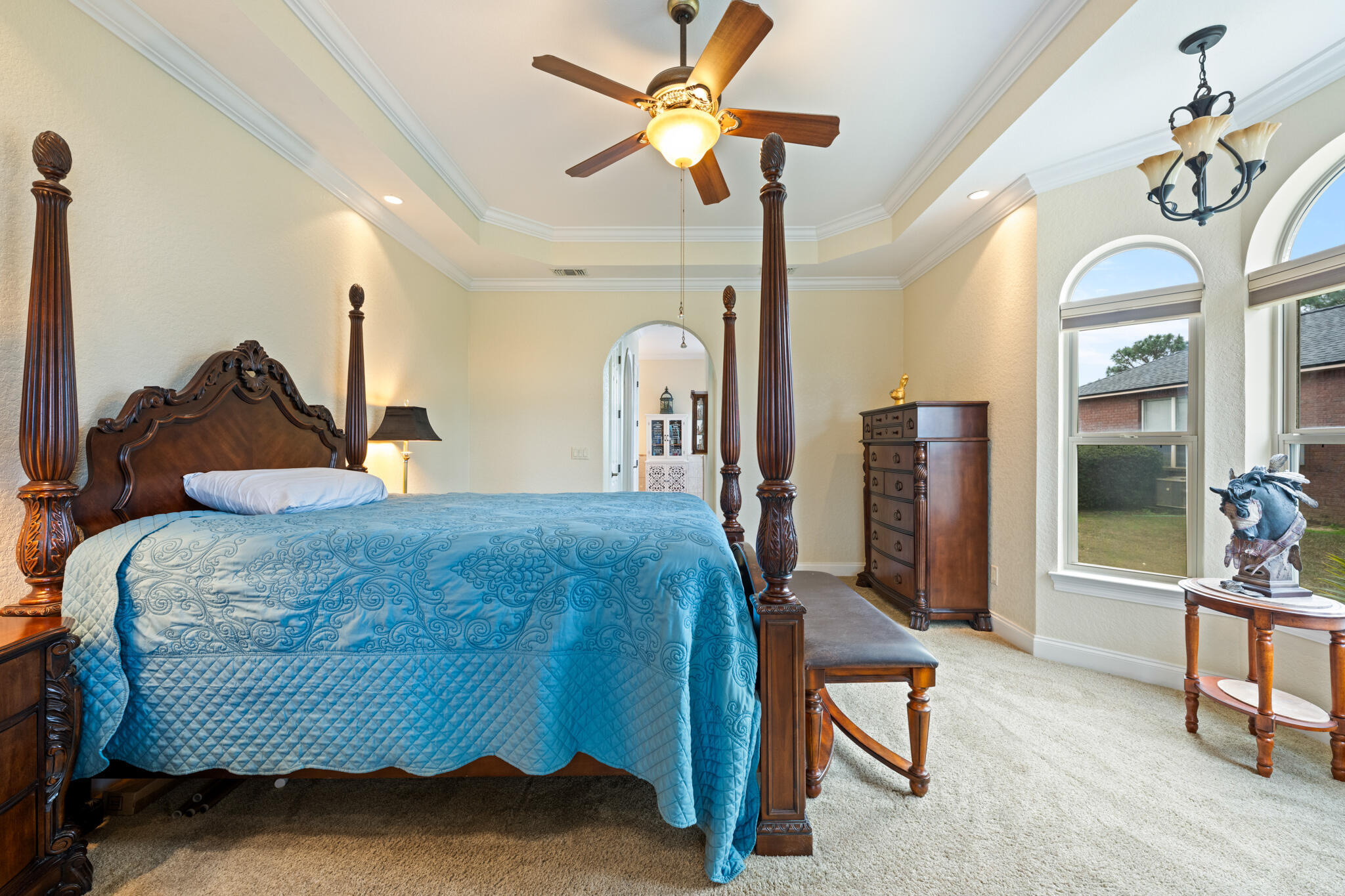 2615 Masters Boulevard Navarre, FL 32566 - Photo 20 of 51 a bed room with a bed and a chandelier
