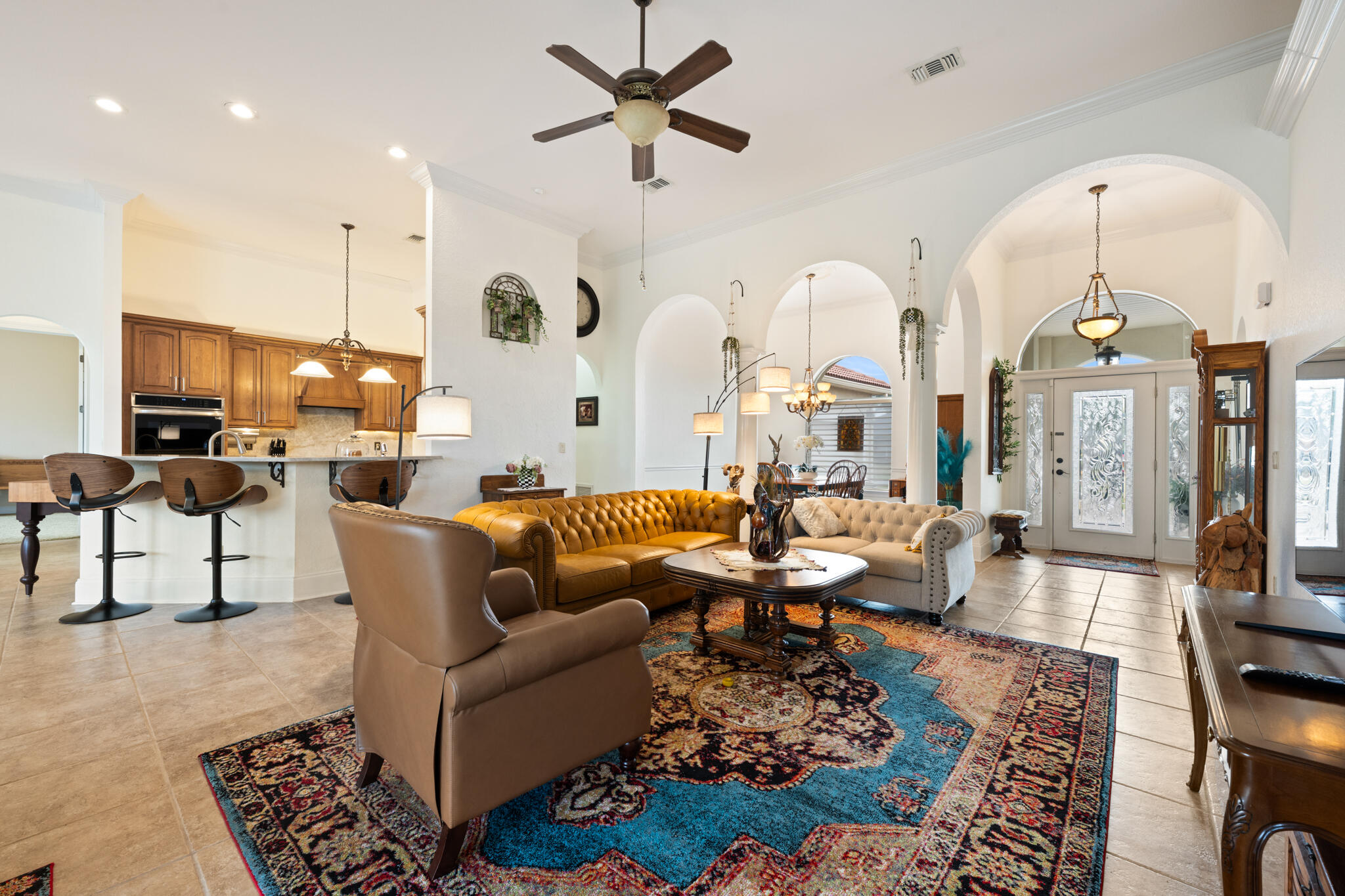 2615 Masters Boulevard Navarre, FL 32566 - Photo 24 of 51 a living room with fireplace furniture and a chandelier