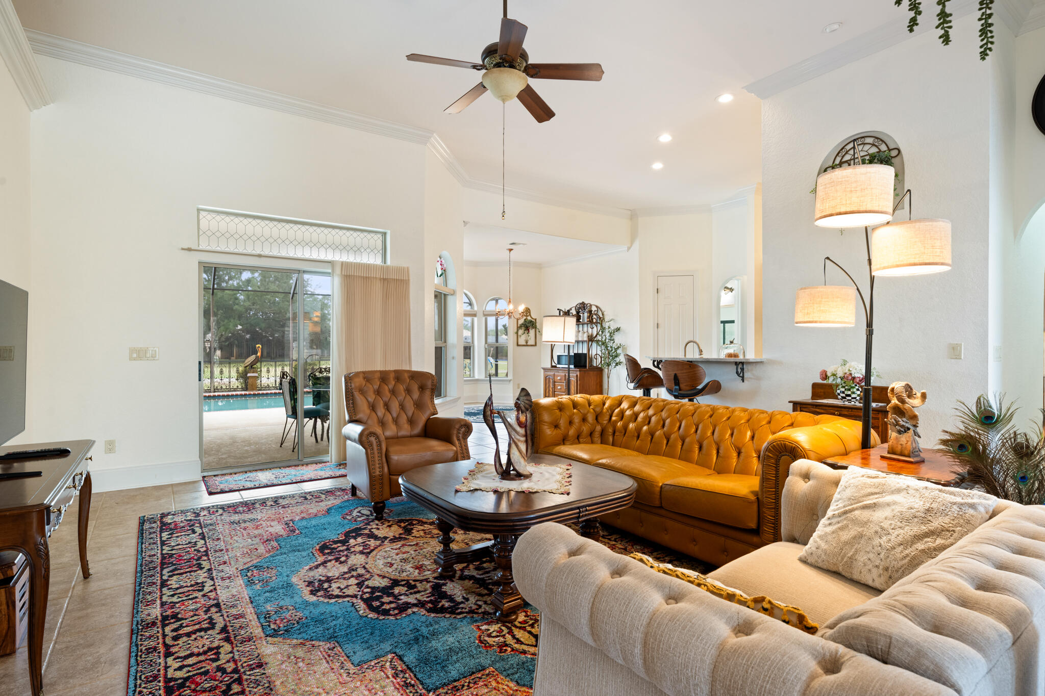 2615 Masters Boulevard Navarre, FL 32566 - Photo 26 of 51 a living room with furniture ceiling fan and a rug
