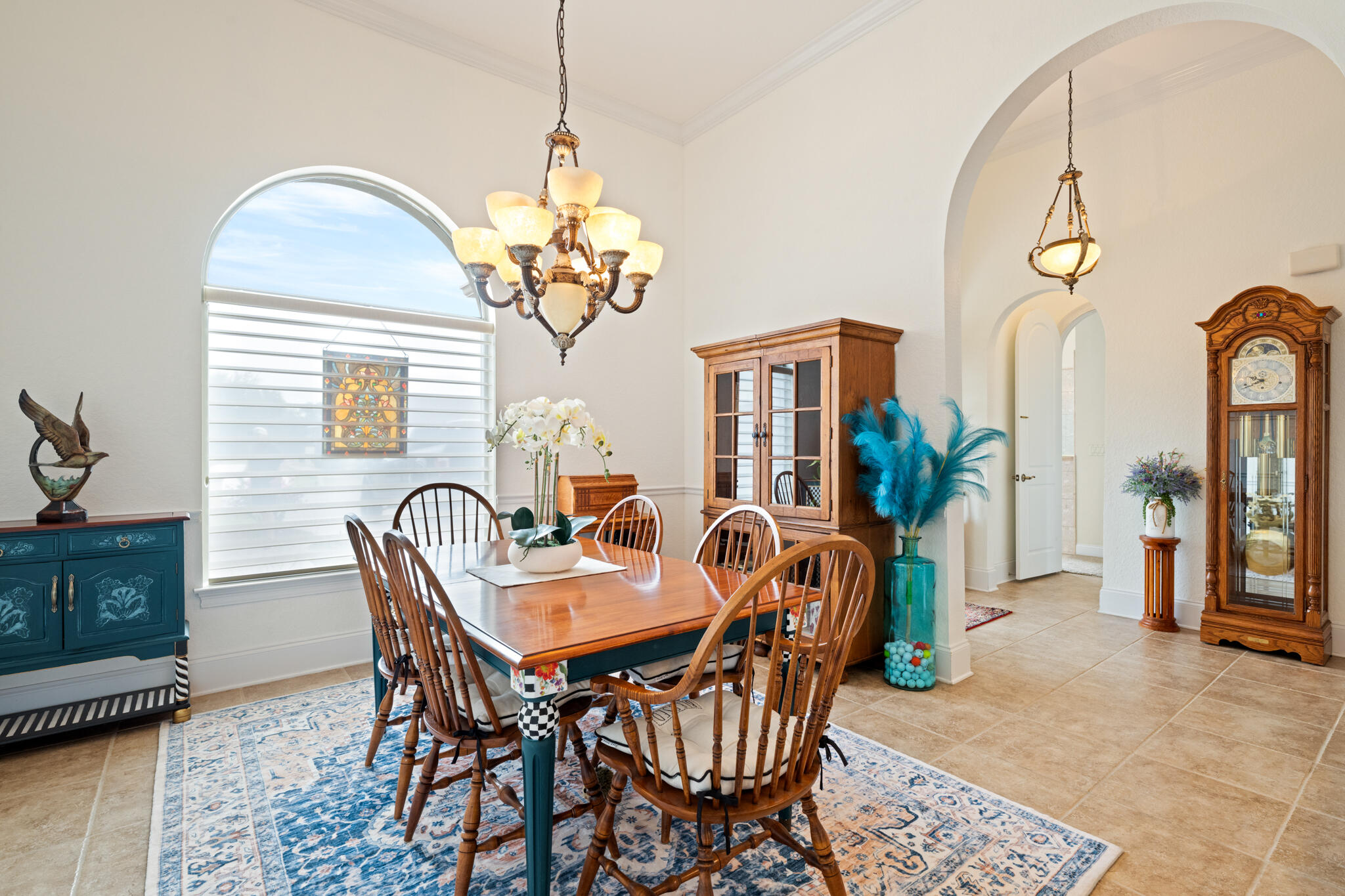 2615 Masters Boulevard Navarre, FL 32566 - Photo 27 of 51 a dining room with furniture a chandelier and wooden floor