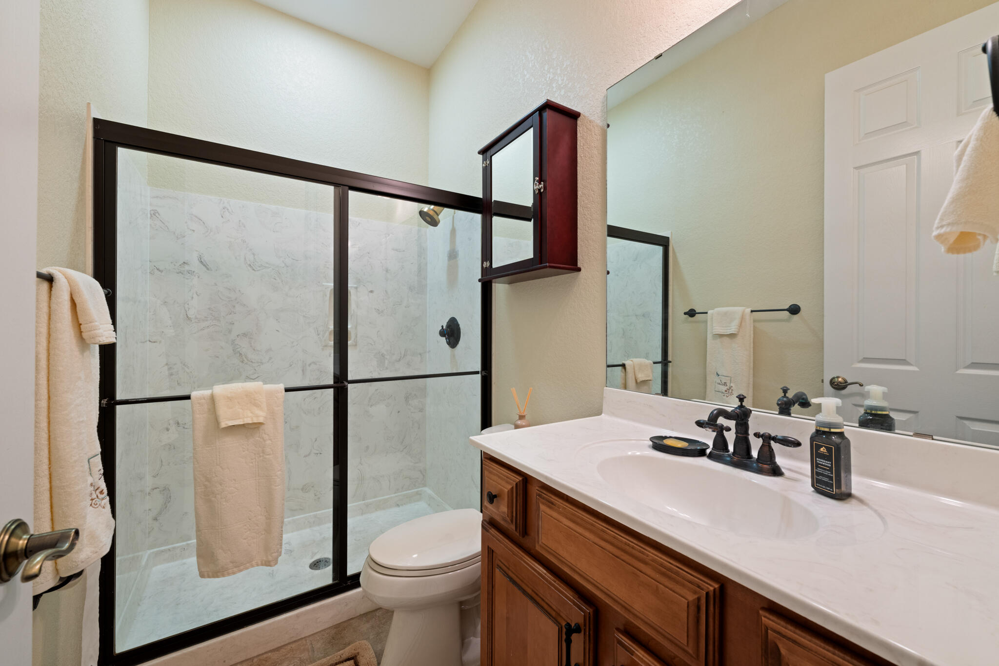 2615 Masters Boulevard Navarre, FL 32566 - Photo 39 of 51 a bathroom with a sink toilet and a mirror