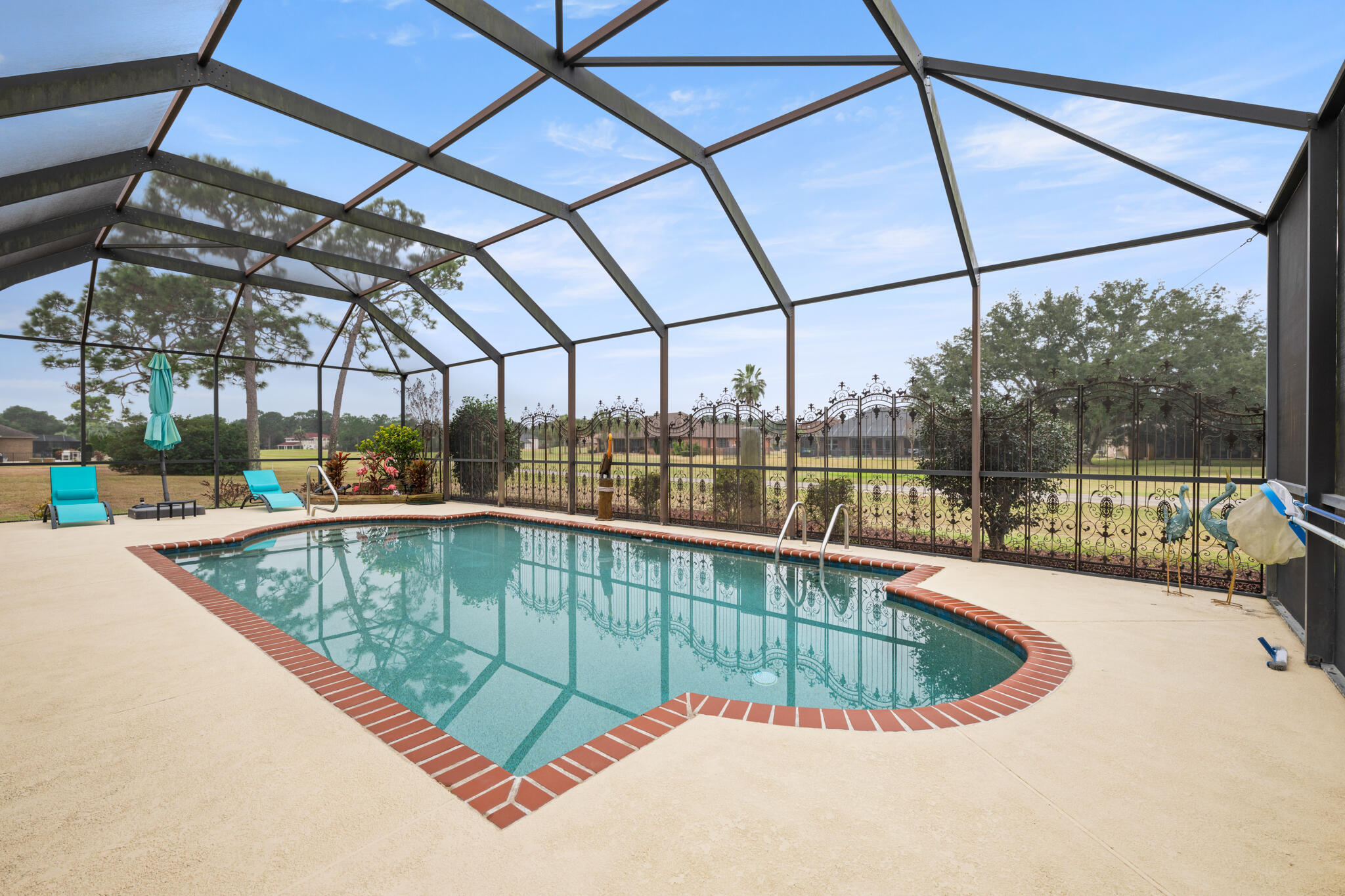 2615 Masters Boulevard Navarre, FL 32566 - Photo 4 of 51 a view of a swimming pool with a roof deck