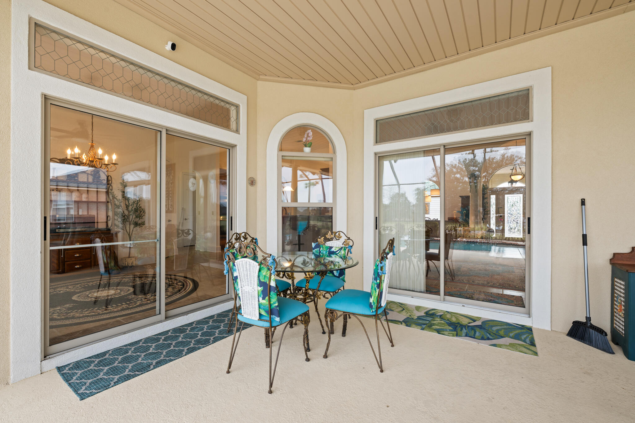 2615 Masters Boulevard Navarre, FL 32566 - Photo 42 of 51 a dining room with furniture and a floor to ceiling window