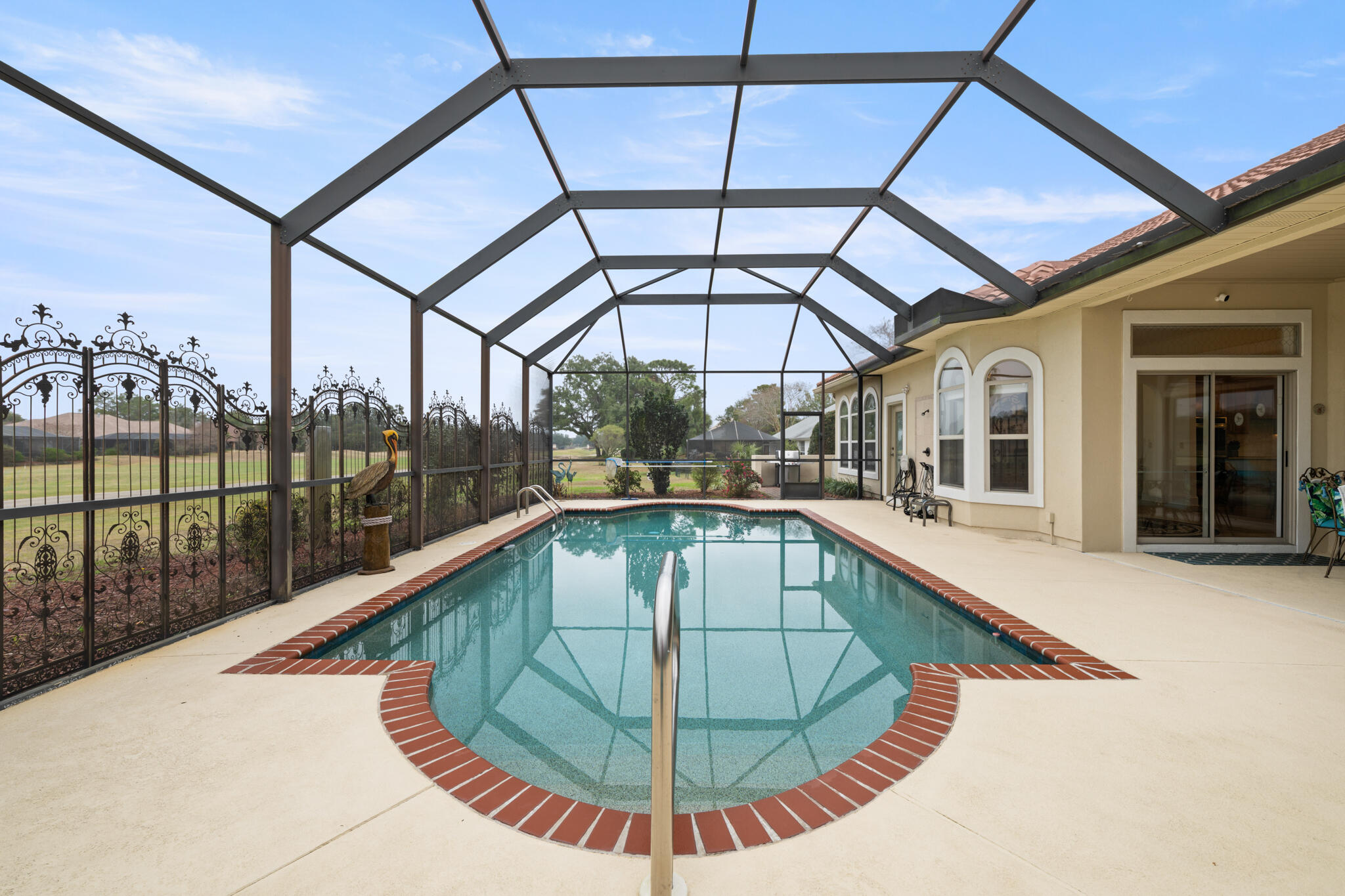 2615 Masters Boulevard Navarre, FL 32566 - Photo 44 of 51 a view of a swimming pool with a porch