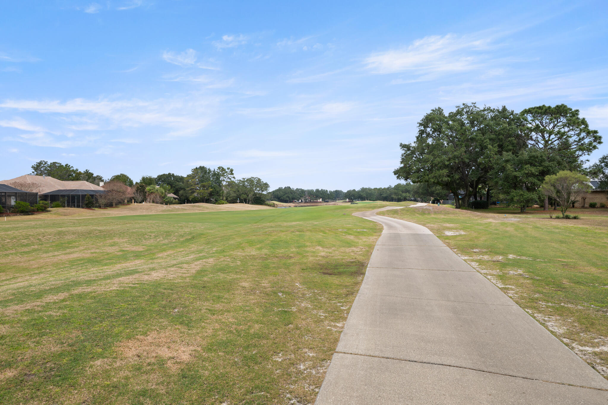 2615 Masters Boulevard Navarre, FL 32566 - Photo 48 of 51 a view of a lake with a big yard
