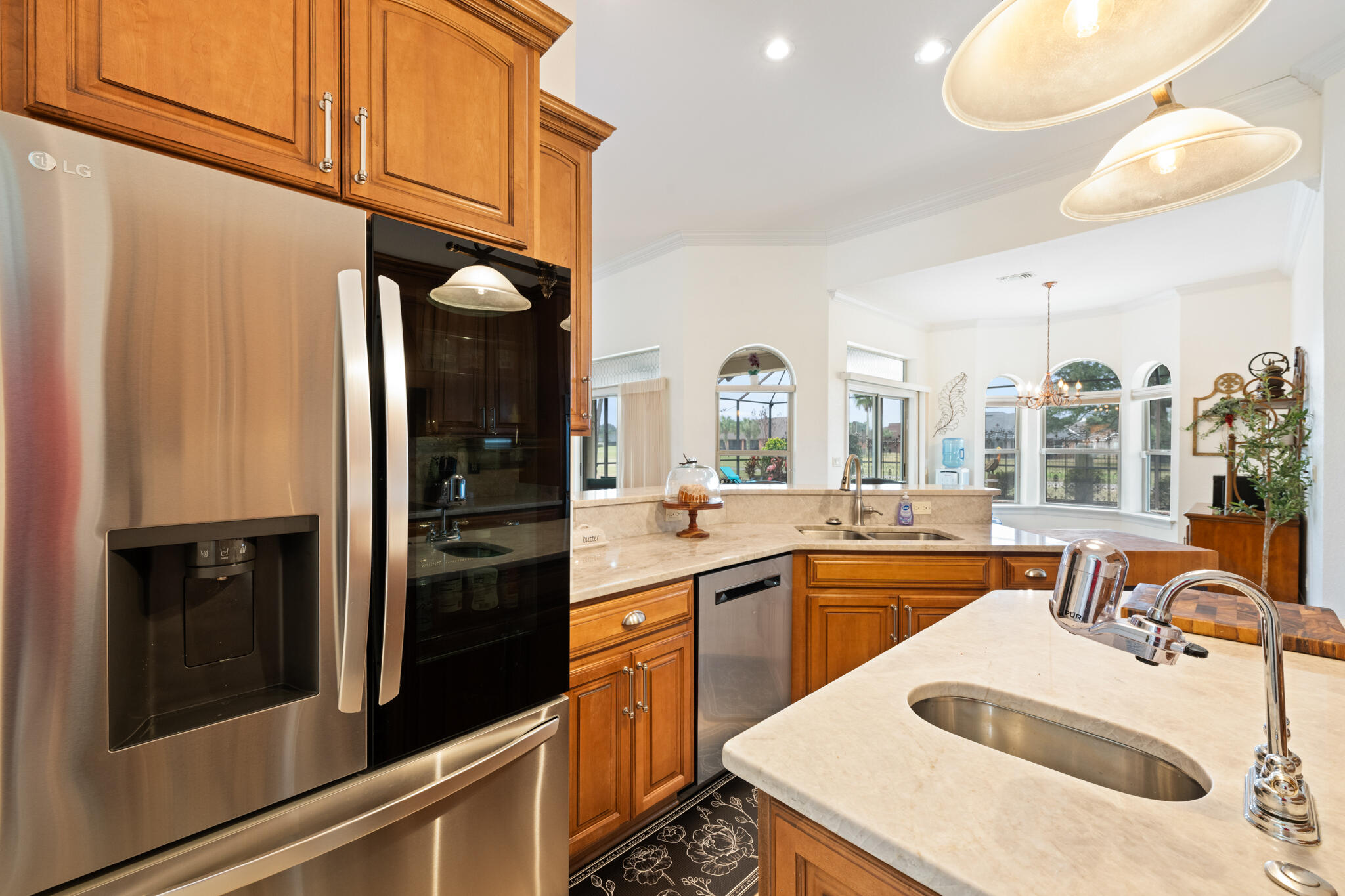 2615 Masters Boulevard Navarre, FL 32566 - Photo 9 of 51 a kitchen with a sink cabinets and stainless steel appliances