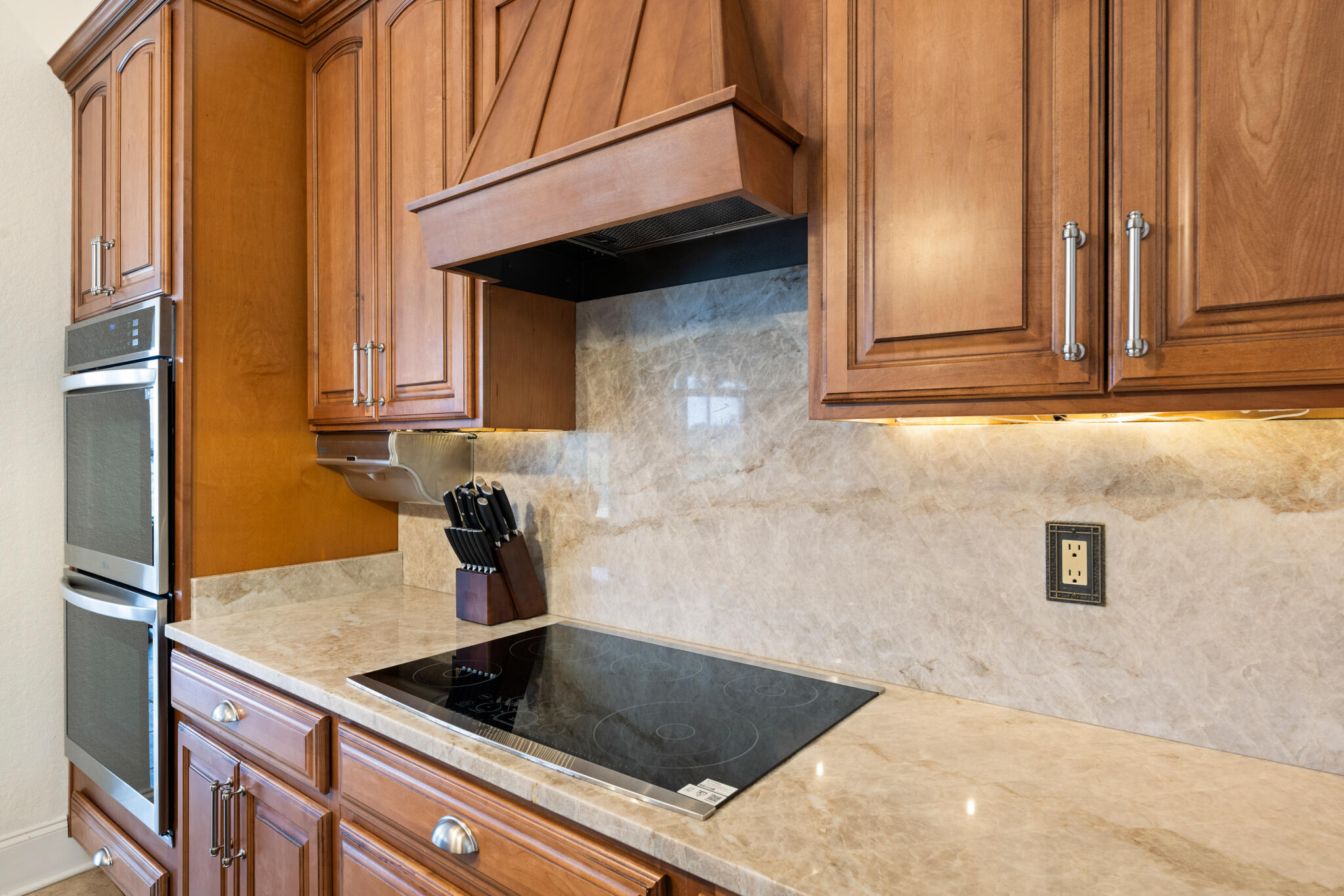 2615 Masters Boulevard Navarre, FL 32566 - Photo 10 of 51 a kitchen with granite countertop a sink and a stove top oven