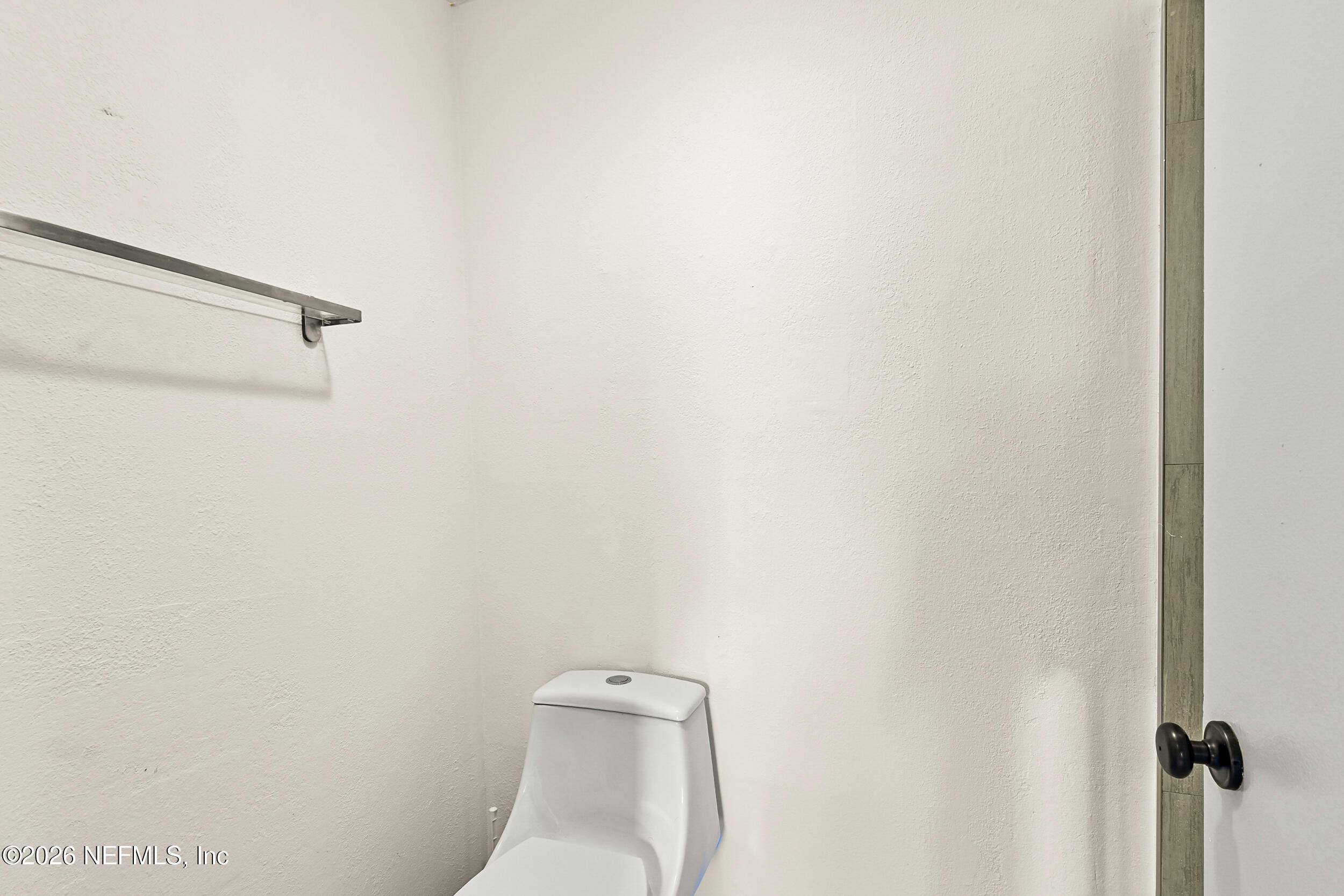4915 Baymeadows Road, Unit 6G Jacksonville, FL 32217 - Photo 24 of 44 a white toilet sitting next to a shower