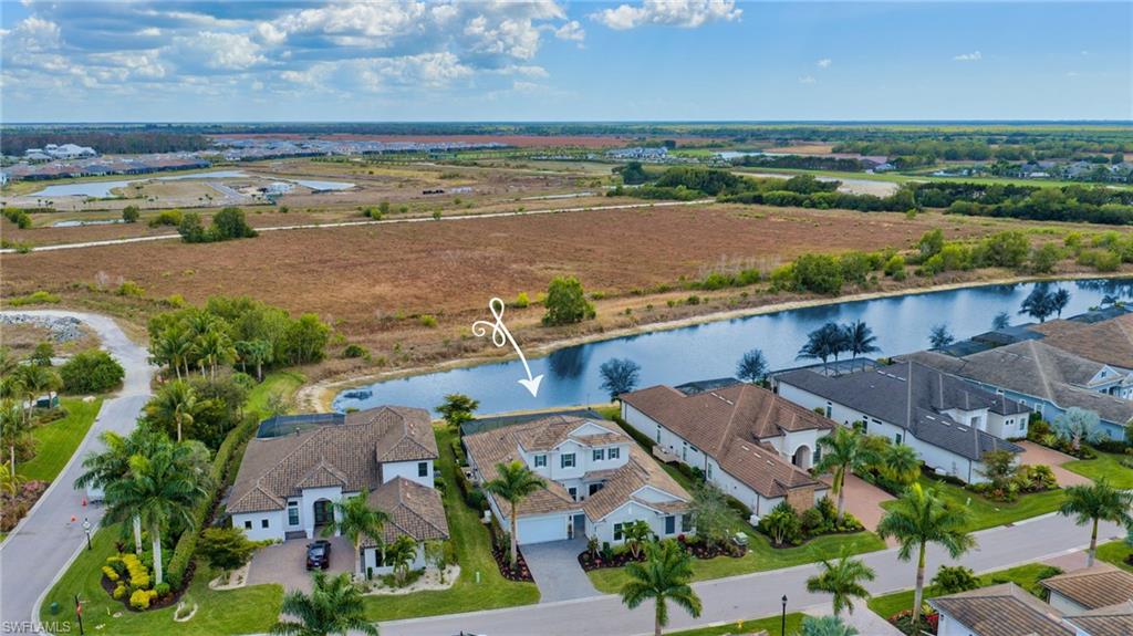 3410 Wellfleet Lane Naples, FL 34114 - Photo 24 of 28 an aerial view of ocean and residential houses with outdoor space