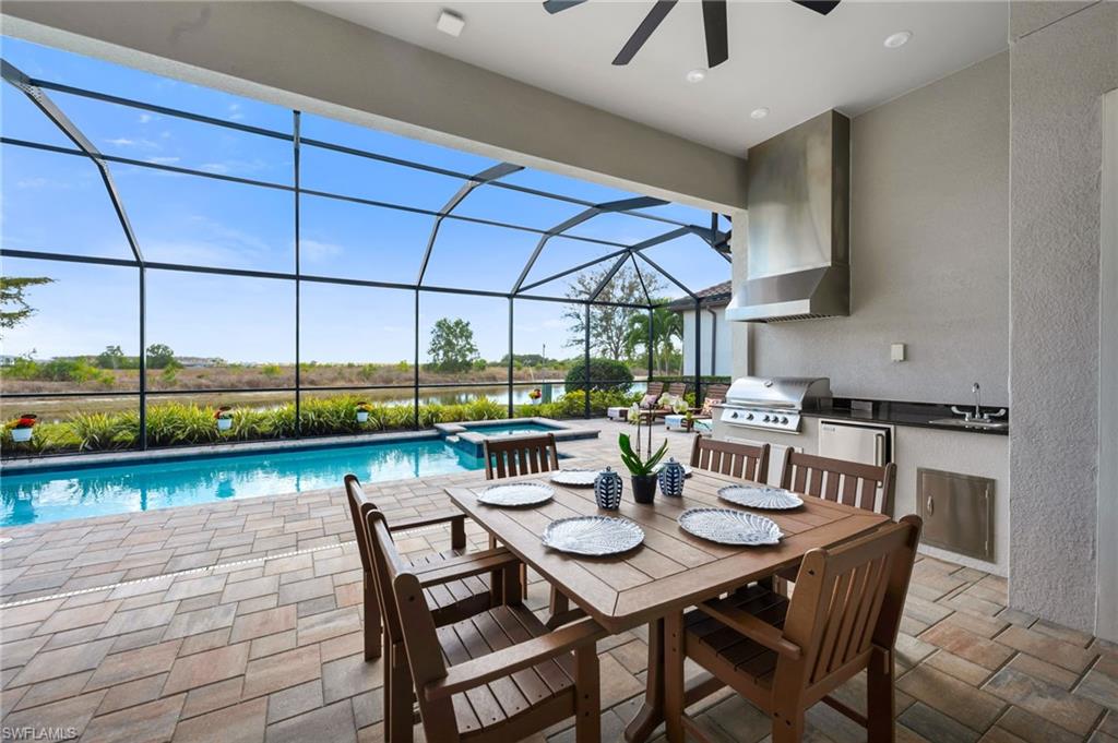 3410 Wellfleet Lane Naples, FL 34114 - Photo 3 of 28 a view of a dining room with furniture and window